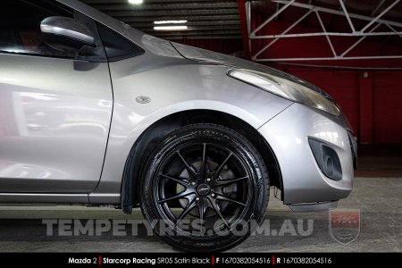 16x7.0 Starcorp Racing SR05 Satin Black on Mazda 2