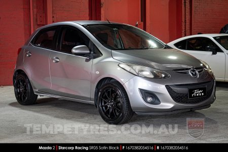 16x7.0 Starcorp Racing SR05 Satin Black on Mazda 2